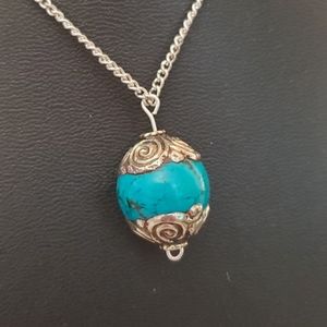 Sterling silver necklace with turquoise and silver pendant